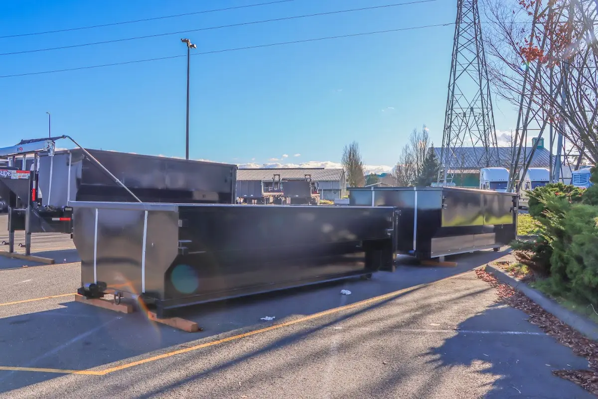 Roll-off dumpster ready for waste disposal at job site for 12 Yard Dumpster Rental in Holmen